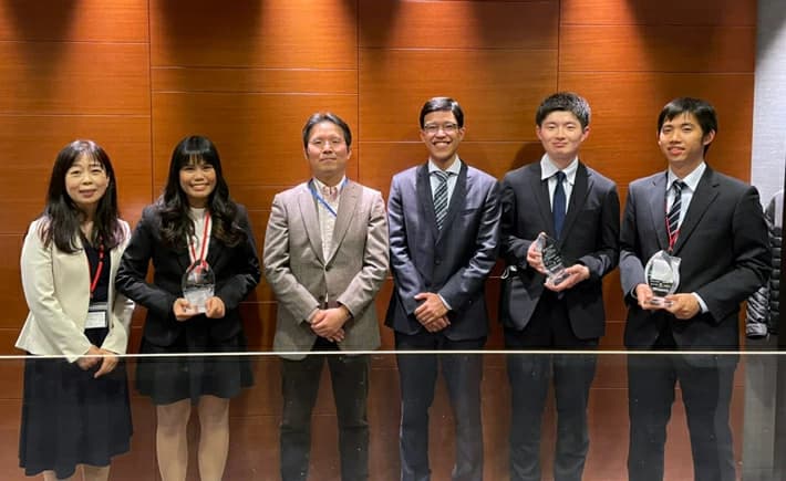 The winning team with their faculty advisor and mentor from Asset Management One